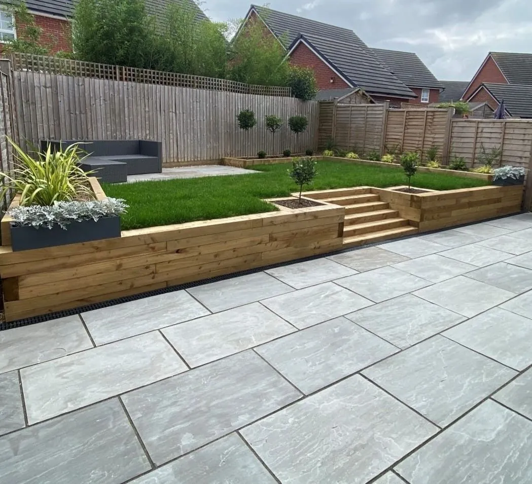 A cleared and tidied garden with a fresh lawn, ready to be enjoyed again