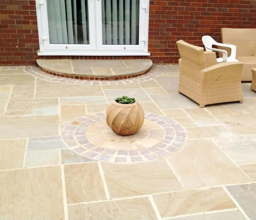 A finished patio with garden furniture, created by Amber and Sisters